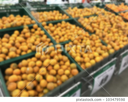 Blurred tangerines in supermarket 103479598