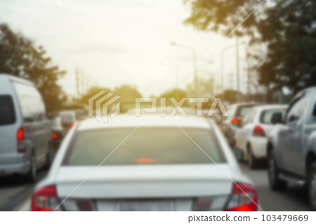 Blurred row of car on evening treaffic jam hour Blurred row of car on evening treaffic jam hour 103479669