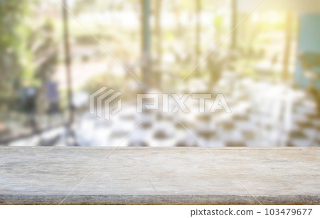 Wood table top on blur coffee shop or kitchen window background 103479677