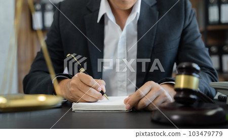 Lawyer in office. Businessmen sitting at desk and making notes. 103479779