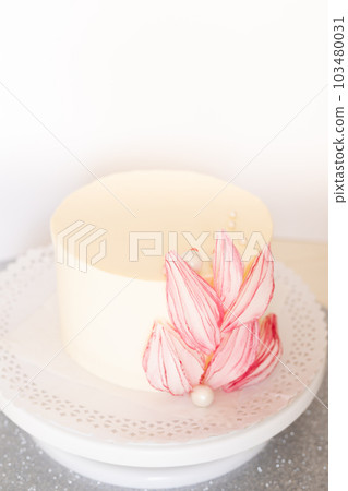White cake with beautiful flowers on a light background. 103480031
