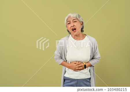 Unwell mature 60s woman touching belly suffering from stomach ache, indigestion, gastritis or diarrhea Unwell mature 60s woman touching belly suffering from stomach ache, indigestion, gastritis or diarrhea 103480215