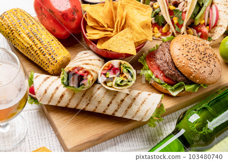 Mexican food featuring tacos, burritos, nachos, burgers Mexican food featuring tacos, burritos, nachos, burgers 103480740