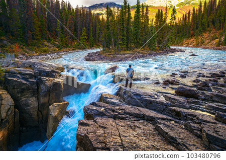 Hiker at the f Upper Sunwapta Falls in Jasper National Park, Canada Hiker at the f Upper Sunwapta Falls in Jasper National Park, Canada 103480796