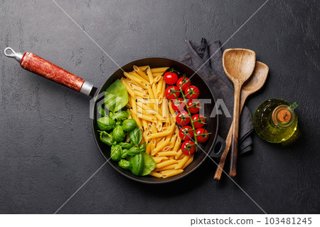 A vibrant representation of the Italian flag made with pasta, basil, and tomatoes A vibrant representation of the Italian flag made with pasta, basil, and tomatoes 103481245