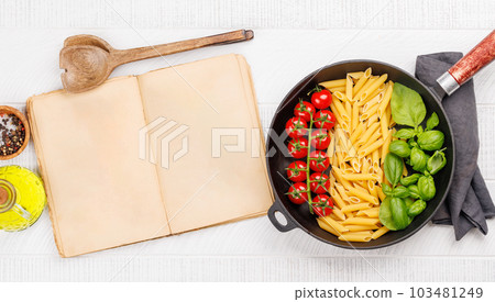 A vibrant representation of the Italian flag made with pasta, basil, and tomatoes A vibrant representation of the Italian flag made with pasta, basil, and tomatoes 103481249