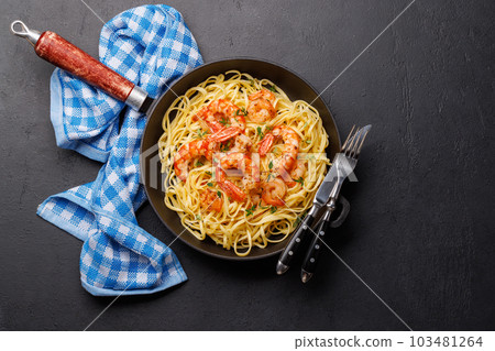A delightful Italian pasta adorned with shrimps A delightful Italian pasta adorned with shrimps 103481264