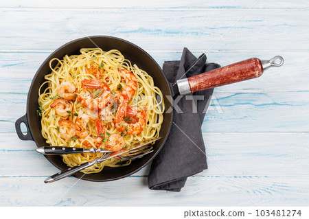 A delightful Italian pasta adorned with shrimps A delightful Italian pasta adorned with shrimps 103481274