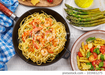 A delightful Italian pasta adorned with shrimps 103481275