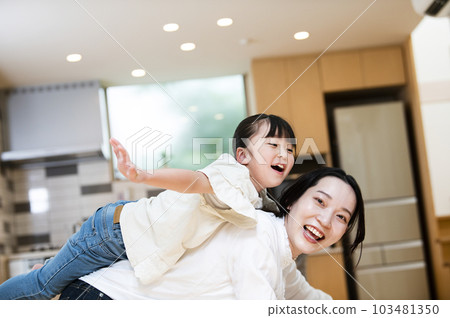 Girl playing with mom 103481350