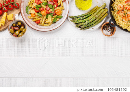 Italian pasta adorned with fresh tomatoes and aromatic basil Italian pasta adorned with fresh tomatoes and aromatic basil 103481392