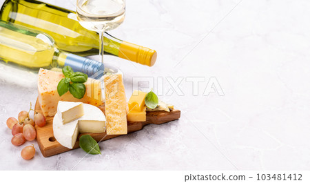Various cheese on board and white wine Various cheese on board and white wine 103481412