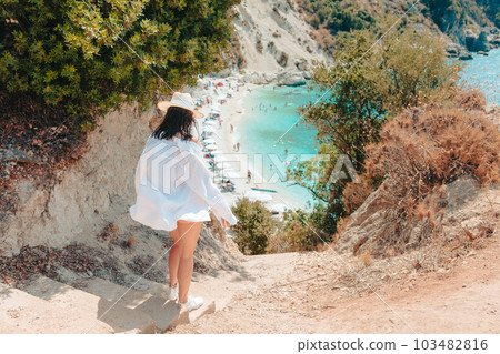 happy beautiful woman going to the sea beach happy beautiful woman going to the sea beach 103482816