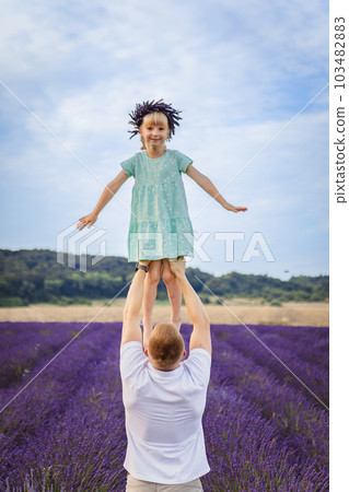 father lifts his daughter father lifts his daughter 103482883