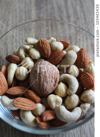 Vertical Stock Photo Of Glass Plate With Heap Of Whole And Shelled Nuts Detailed 103483439