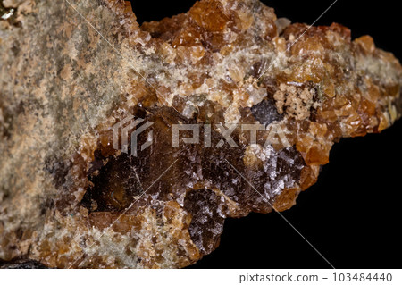 macro mineral stone Grossular, Garnet, Epidote on a black background 103484440
