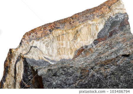 Macro mineral stone Snake eye in the rock a white background 103486794