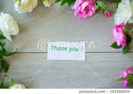 Floral background of pink and white roses on a light wooden Floral background of pink and white roses on a light wooden 103486844