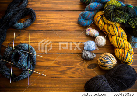 Colored threads, knitting needles and other items for hand knitting 103486859