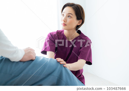 A woman in a wine red scrub A woman in a wine red scrub 103487666