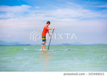 Man on stand up paddle. Water and beach sport 103488021