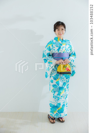 A woman in a yukata A woman in a yukata 103488152