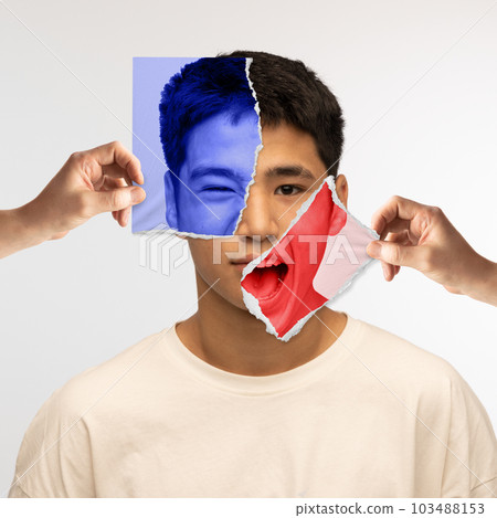 Young asian man and different emotions. Human hands holding piece of photos near face with various facial expressions. Conceptual art collage. Young asian man and different emotions. Human hands holding piece of photos near face with various facial expressions. Conceptual art collage. 103488153