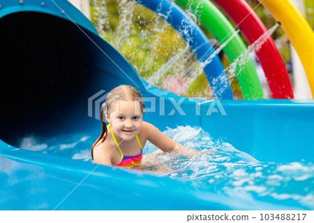 Kids at aqua park. Child in swimming pool. 103488217