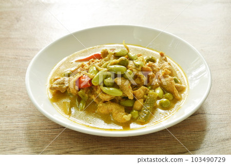 spicy boiled pork and  Nitta tree seed or luk rieng in coconut milk curry soup Thai southern food on plate 103490729