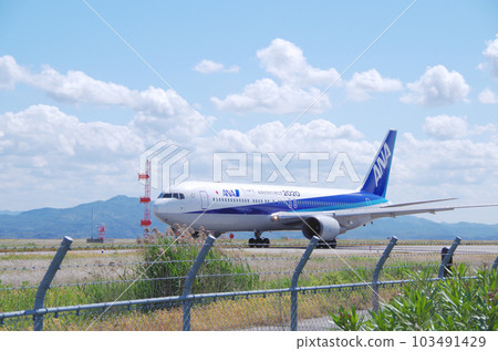 A passenger plane heading for the runway from the taxiway at Yonago Kitaro Airport A passenger plane heading for the runway from the taxiway at Yonago Kitaro Airport 103491429