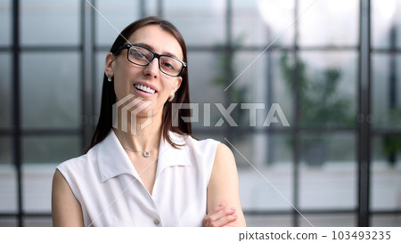 Genuinely attractive female millennial worker expert entrepreneur looking at camera. 103493235
