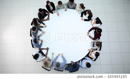 Businesspeople Sitting At Conference Round Table At The Meeting Businesspeople Sitting At Conference Round Table At The Meeting 103493285