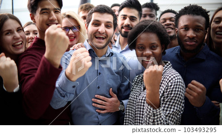 Confident diverse college students show fist up. 103493295