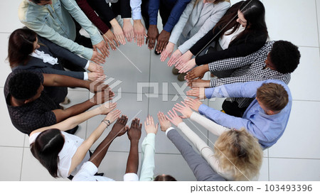 Friends with stack of hands showing unity and teamwork. Friends with stack of hands showing unity and teamwork. 103493396