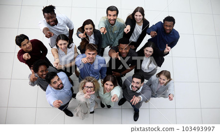 Diverse group of people standing together and waving Diverse group of people standing together and waving 103493997