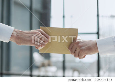 Give someone money in envelop for corruption purposes 103494183