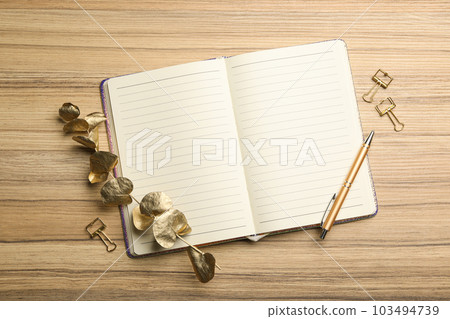 Stylish notebook on wooden table, flat lay Stylish notebook on wooden table, flat lay 103494739