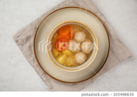 Portion of healthy soup with meatballs 103496630