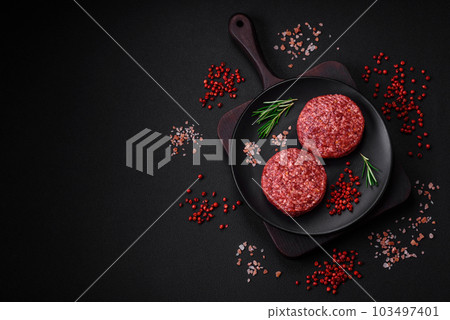 Fresh raw ground beef burger patty with salt and spices Fresh raw ground beef burger patty with salt and spices 103497401