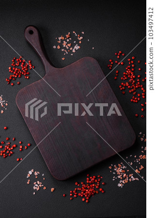 Empty wooden cutting board with thyme, spices, salt and herbs 103497412