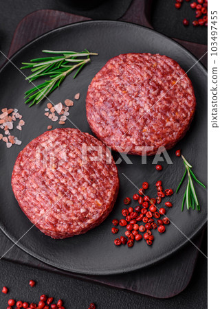 Fresh raw ground beef burger patty with salt and spices Fresh raw ground beef burger patty with salt and spices 103497455