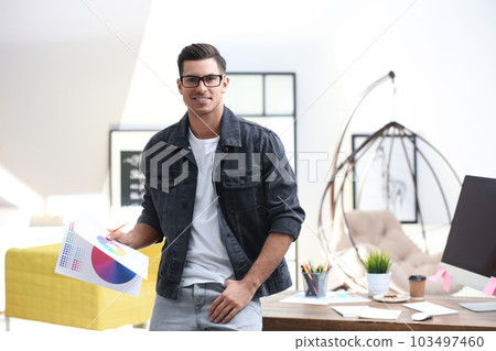 Portrait of male designer in office. Creative profession Portrait of male designer in office. Creative profession 103497460