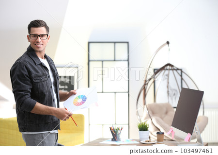 Portrait of male designer in office. Creative profession Portrait of male designer in office. Creative profession 103497461