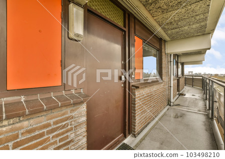 a brick building with an orange sign on the front door that says it's time to get back home a brick building with an orange sign on the front door that says it's time to get back home 103498210