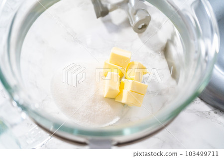 Lemon Cookies with White Chocolate. Mixing ingredients in kitchen mixer to bake lemon cookies with white chocolate. Lemon Cookies with White Chocolate. Mixing ingredients in kitchen mixer to bake lemon cookies with white chocolate. 103499711