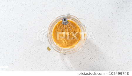 Flat lay. Whipping ingredients in a stand electric mixer to make dulce de leche buttercream frosting. Flat lay. Whipping ingredients in a stand electric mixer to make dulce de leche buttercream frosting. 103499748