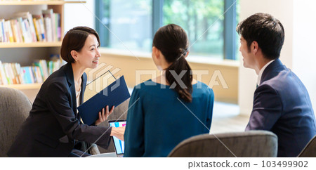 Advisor receiving customer consultation Advisor receiving customer consultation 103499902