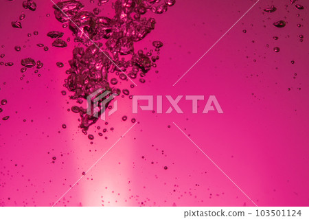 Air bubbles in water red background Air bubbles in water red background 103501124