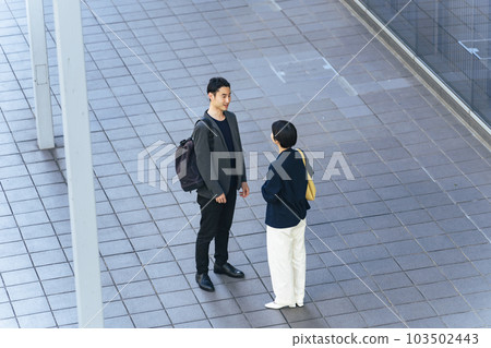A bird's eye view of men and women talking in the city 103502443