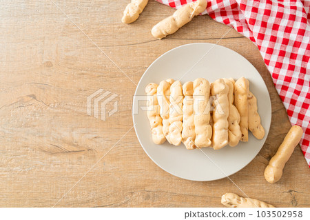 almonds meringue stick on plate 103502958
